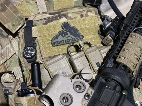 Direct Action K9 patch on a cloth along with a gun