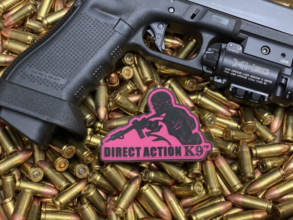 Direct Action K9 along with a gun and bullets