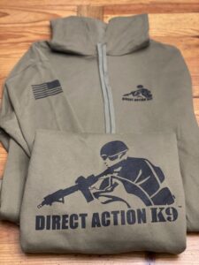 A tactical hoodie with Direct Action K9 logo and American flag patch.