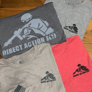 Four t-shirts with 'Direct Action' graphic designs in various colors.